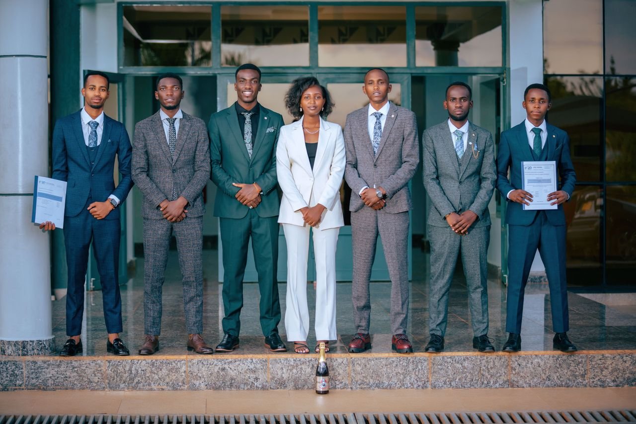 A group of business professionals in suits standing confidently outdoors, embodying teamwork and diversity.